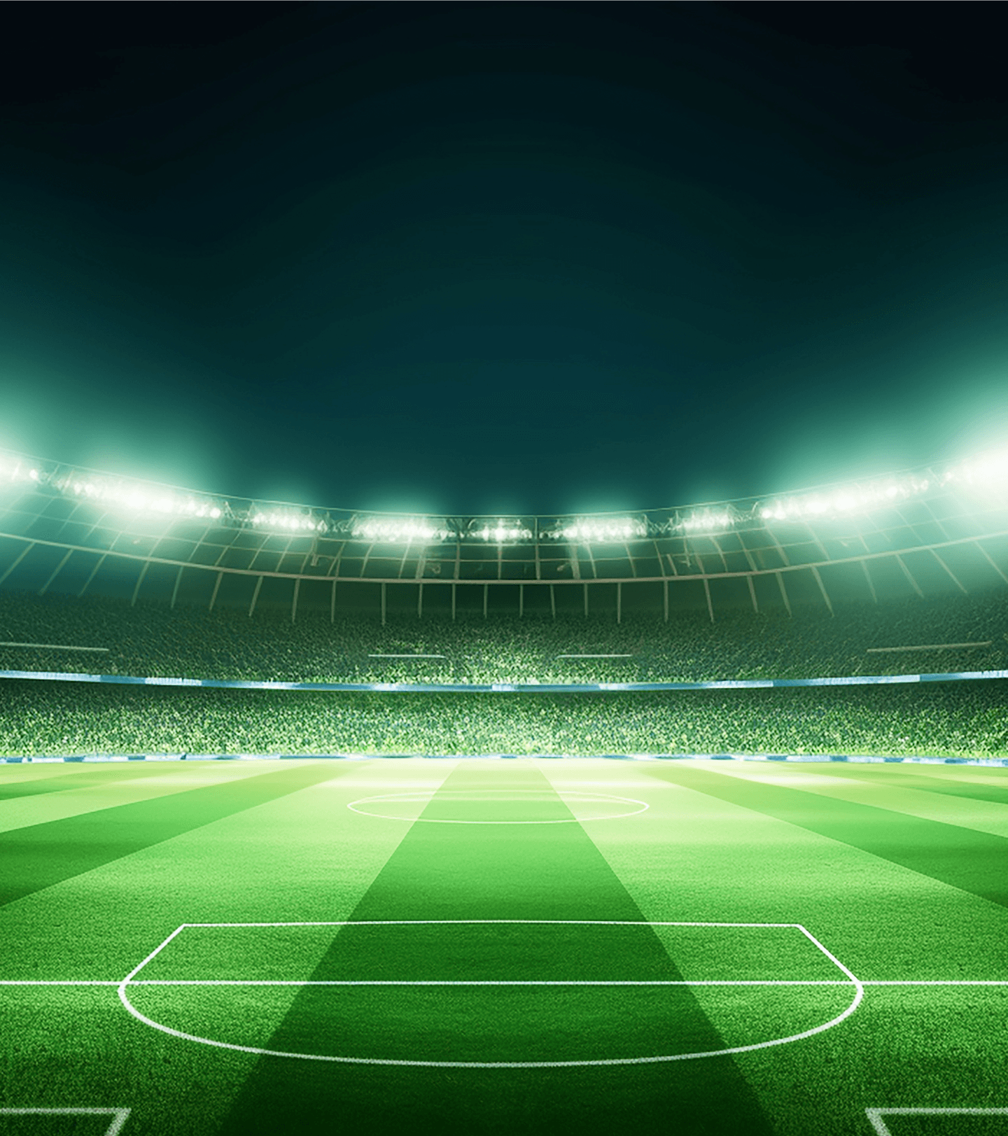 Floodlit football stadium at night