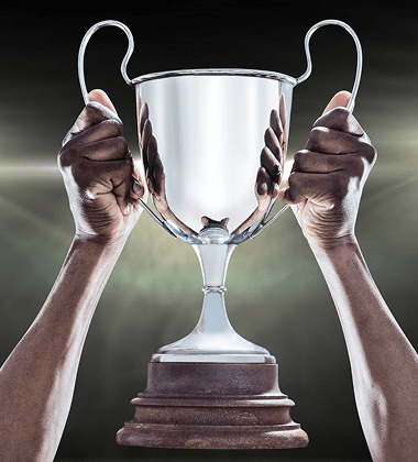 Hands lifting a trophy